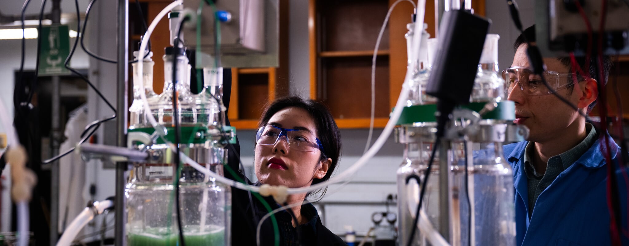 Graduate student and Lei Pan working in the lab