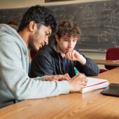 Students working in a dark lab.