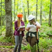 Student assembling equipment in a lab.