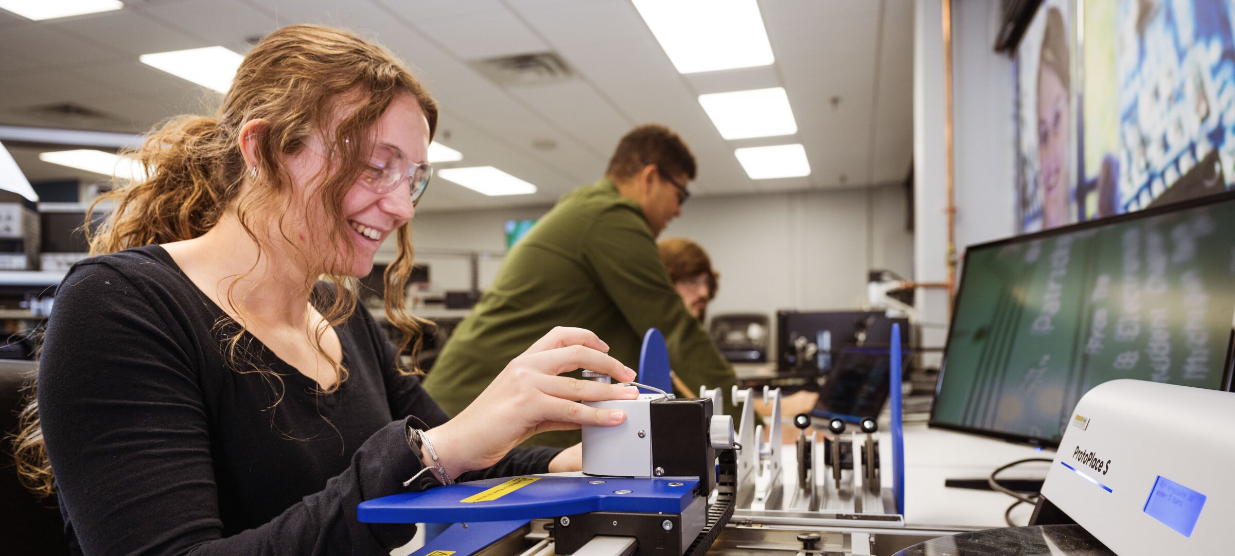 Electrical engineering technology student works with components