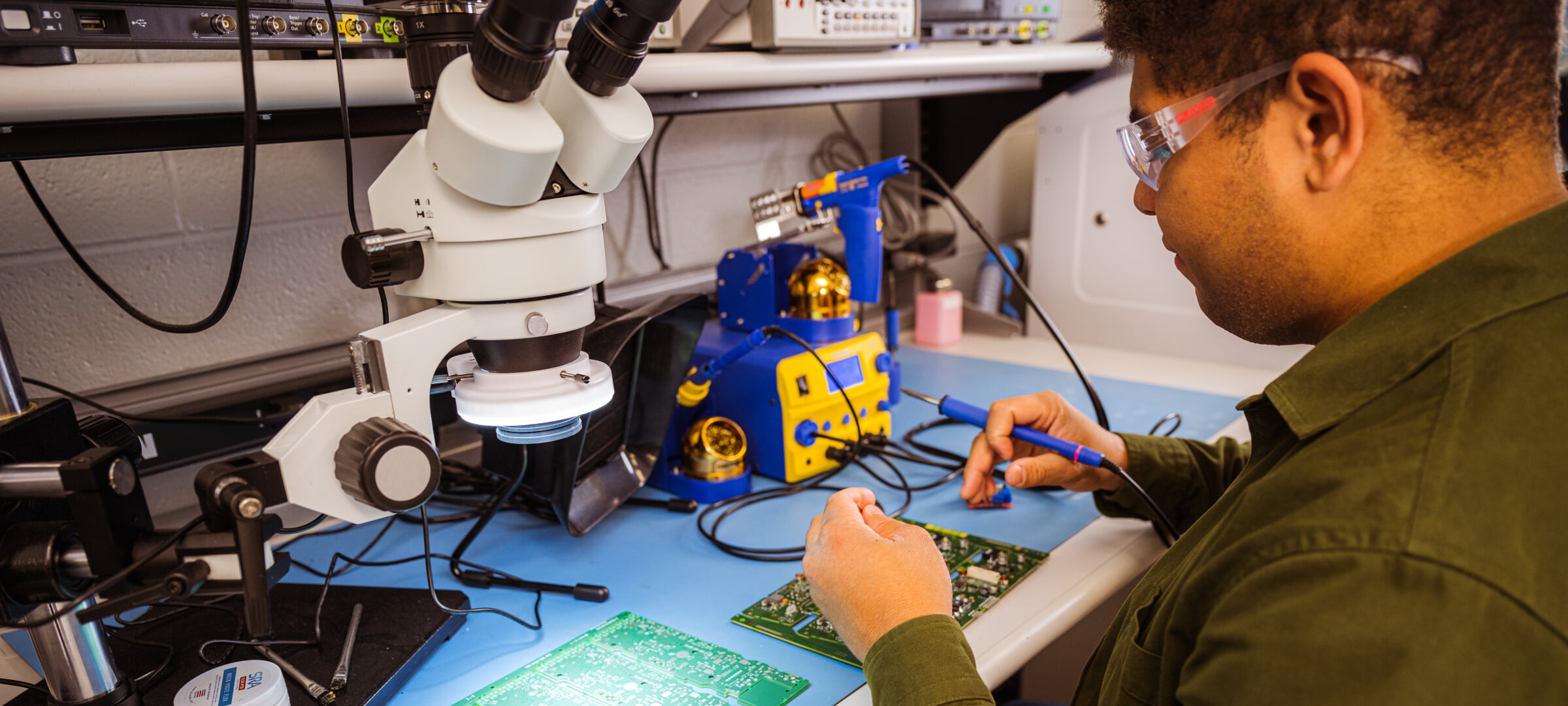 Student in electrical engineering lab.