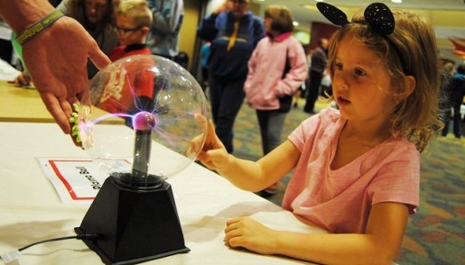 Mind Trekkers student touching an electric ball.
