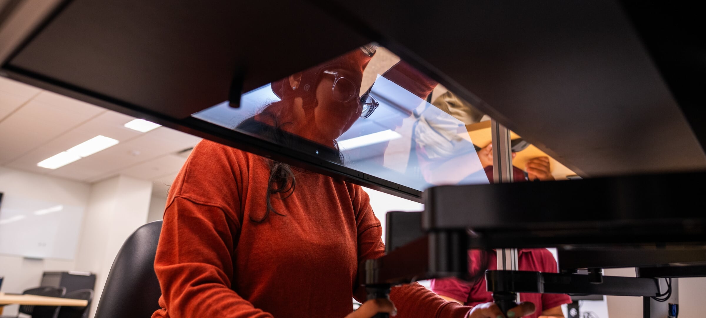 Graduate Human Factors student using hand-eye coordination machine