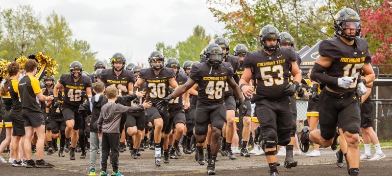 Footbal team entering the field