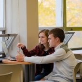 Students working on a laptop