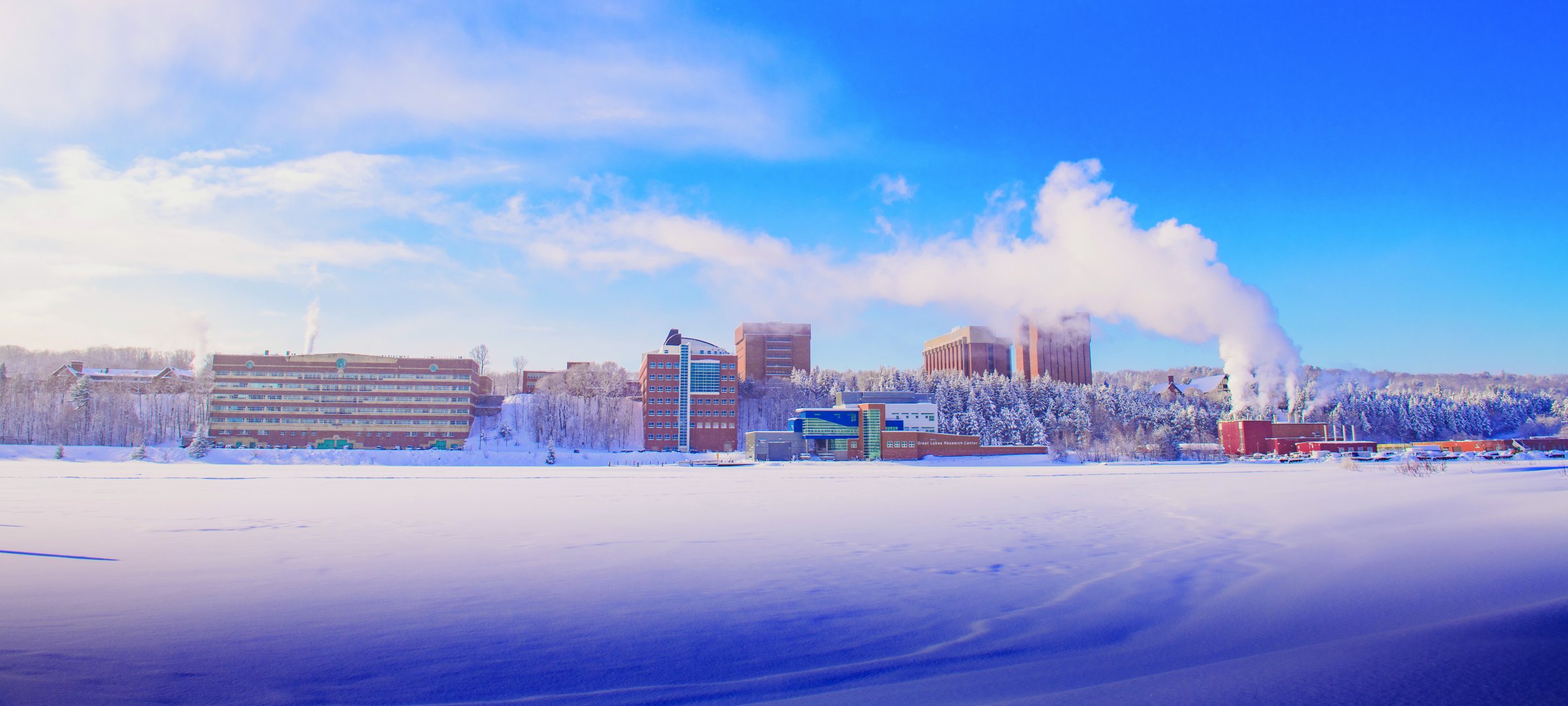 Snowy winter campus from across the canal.