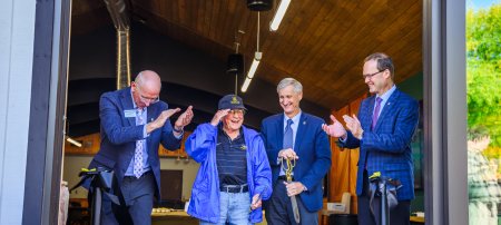 Representatives celebrate after cutting the ribbon at the Steve Danis Conference Room. Pictured (L-R): David Flaspohler, Lieutenant Colonel Stephen J. Danis, Michigan Tech President Rick Koubek, and Andrew Storer