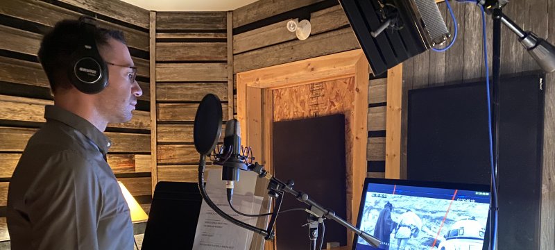  Tech alumnus Kalvin Hartwig ’10 pictured in studio voicing his lines as Red Leader in Star Wars (Anangon Miigaading): A New Hope. (Image credit: Dr. Cary Miller)