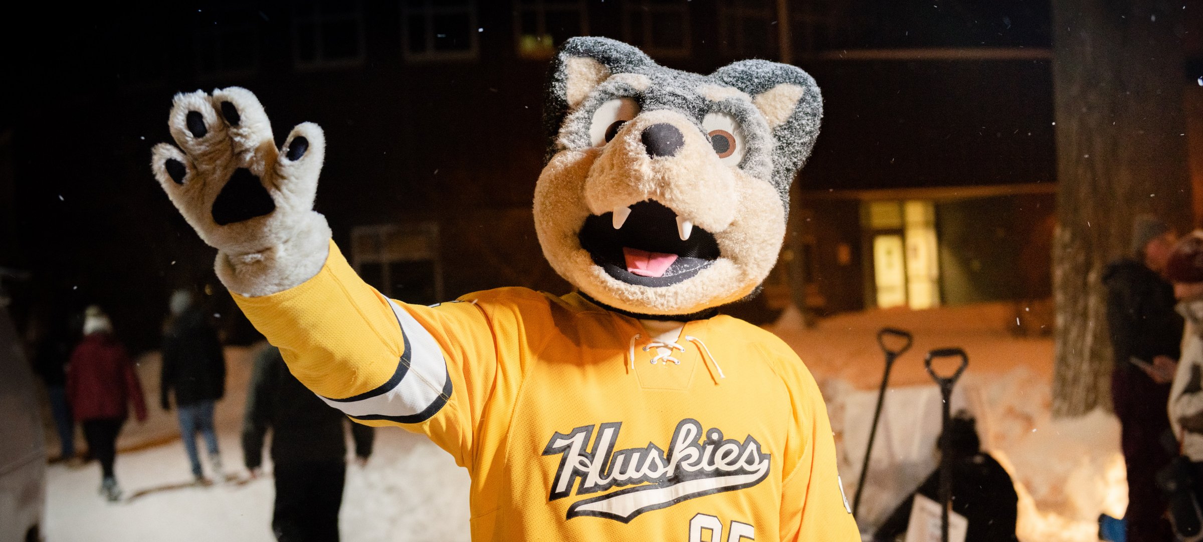 Blizzard T. Husky waves during the Winter Carnival All-Nighter.