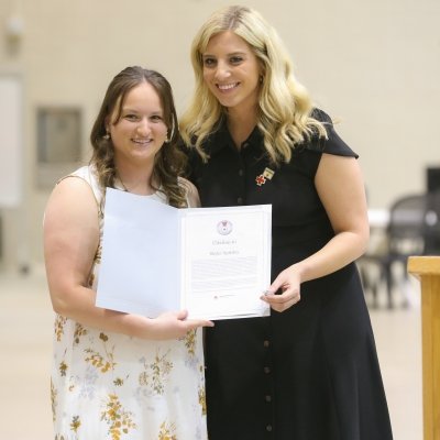 Skyler Spitzley holding her award