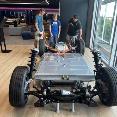 Tech students inspecting the new volkswagen electric drive train