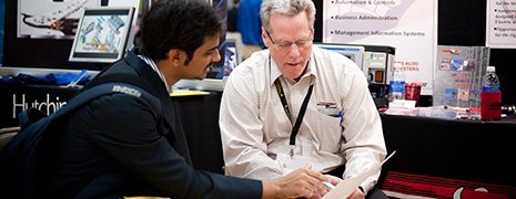 Student talking to a prospective employer.