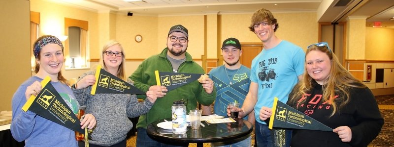 Six alumni with MTU pennants in Career Center