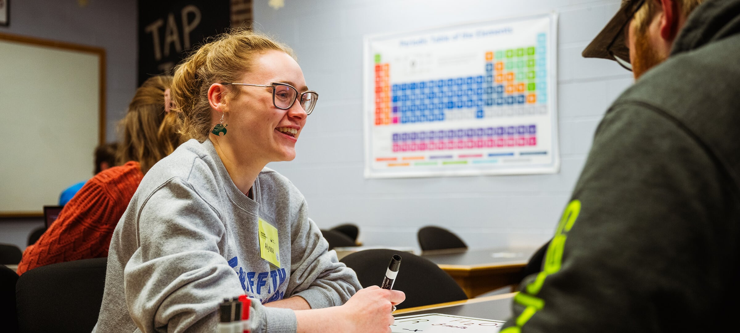 Two chemistry students working on a project