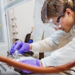 Chemistry student using a lab instrument