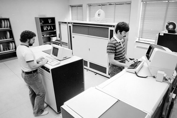 Students working at stand-up computer terminals