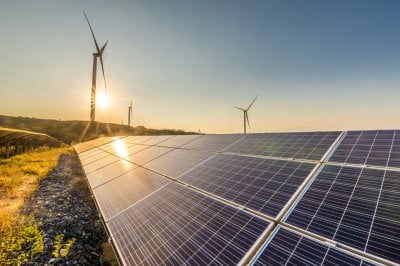 Solar panel with wind turbines 