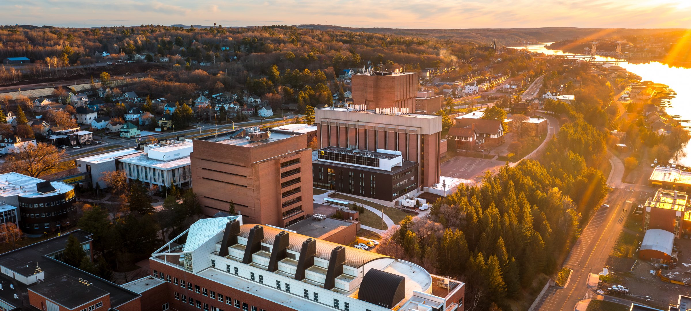 Drone view of campus at sunset in the spring.