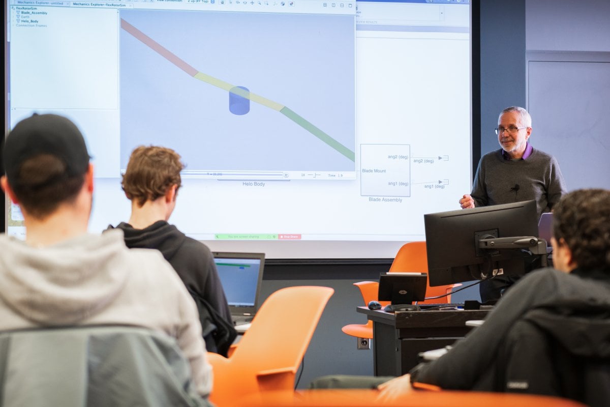 Faculty teaching students in a classroom.