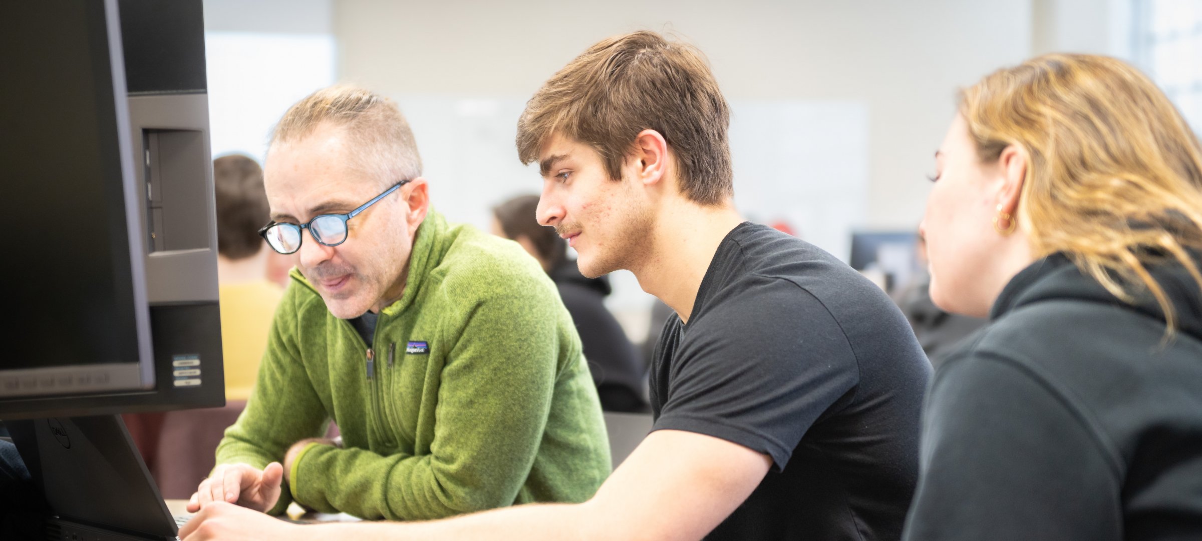 A faculty member working with students.