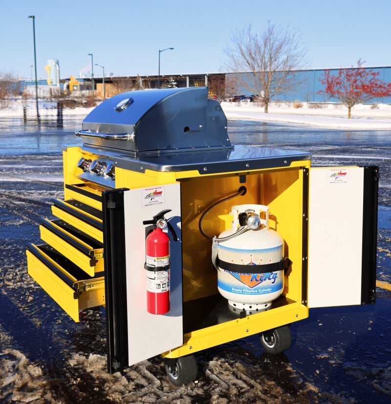 CTech Manufacturing grillcart in bright yellow with shiny chrome details and black wheels and open side door with visible propane tank