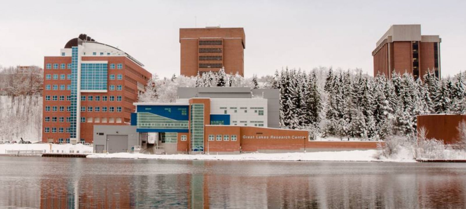 Campus in the winter from across the waterway.