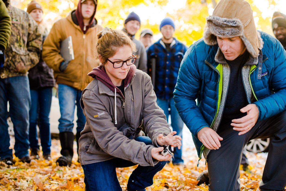 Students looking at a bird.