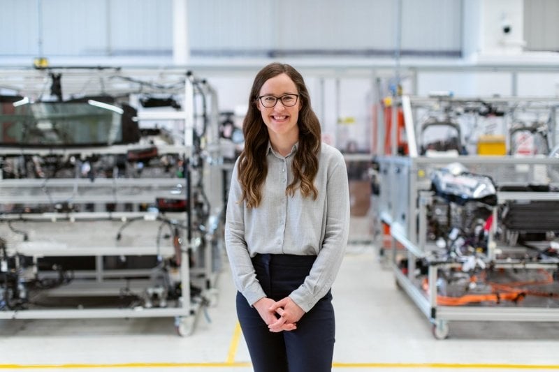 Female engineer standing in workshop.