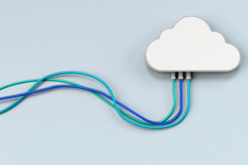 A cloud connected to three computer cables, which symbolizes cloud computing.