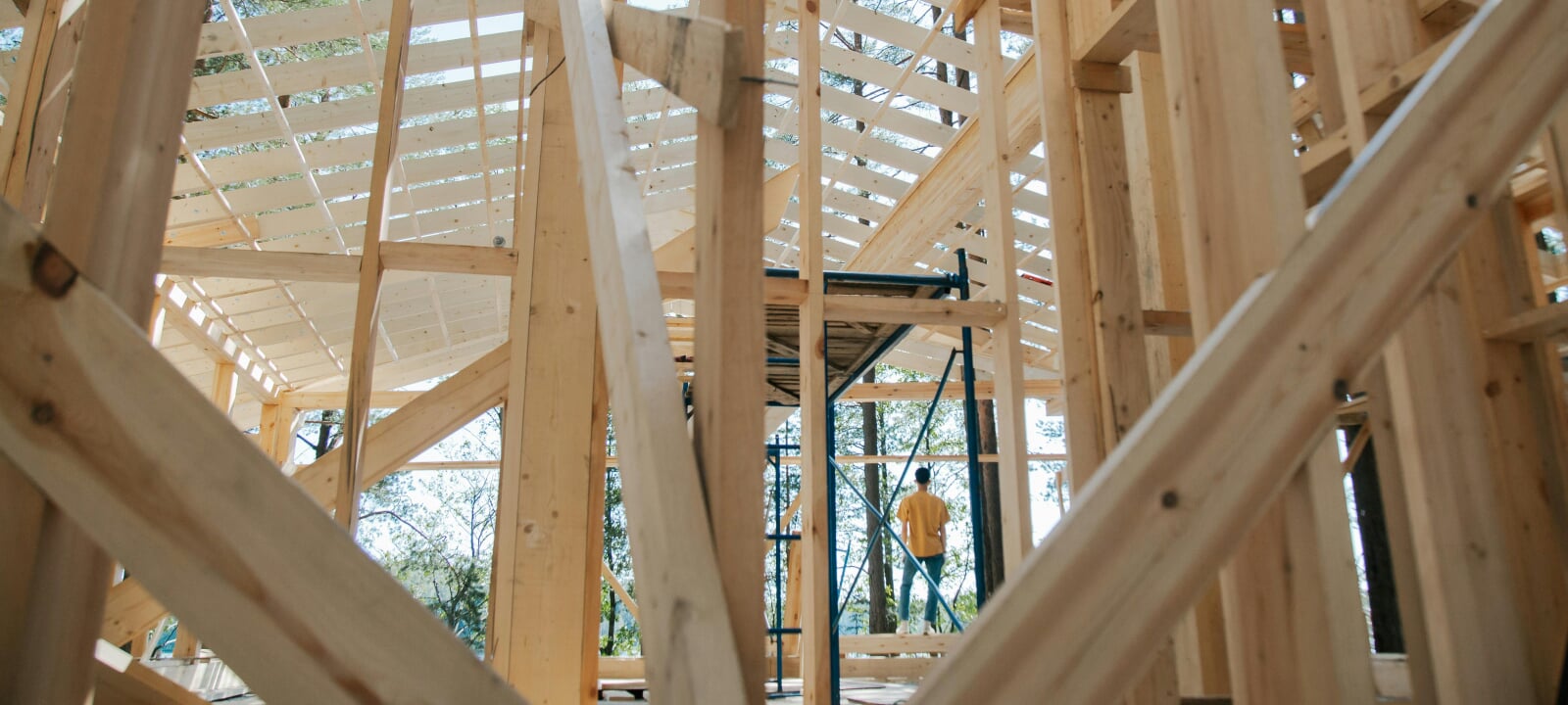 Close up of a wooden building under construction.