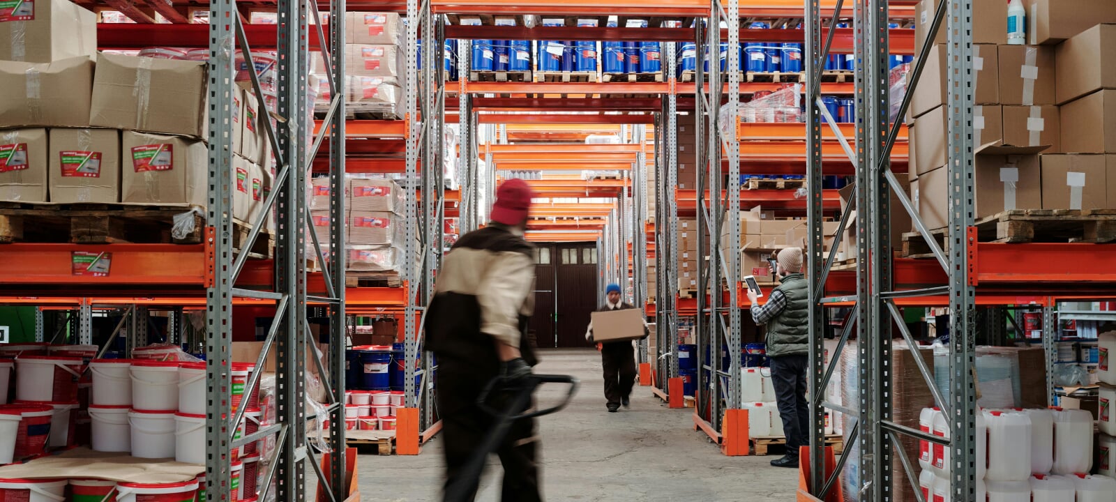 Workers in a busy hardware warehouse