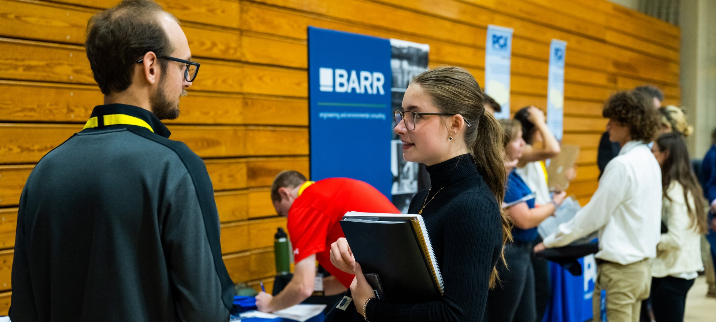 People interacting at a career fair