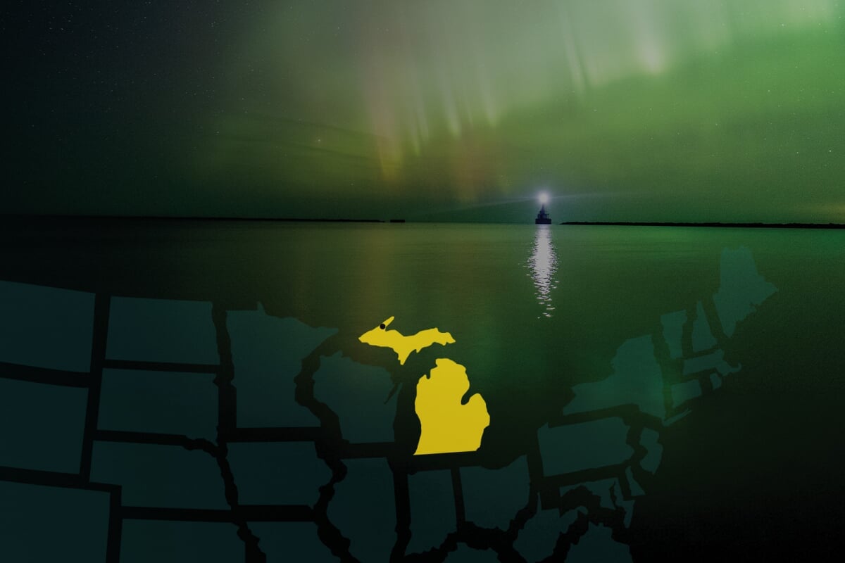 Michigan Technological University is located in Houghton, Michigan. Regional map highlighting Michigan, pointing to the location of Michigan Tech with a lighthouse under a green aurora in the background..
