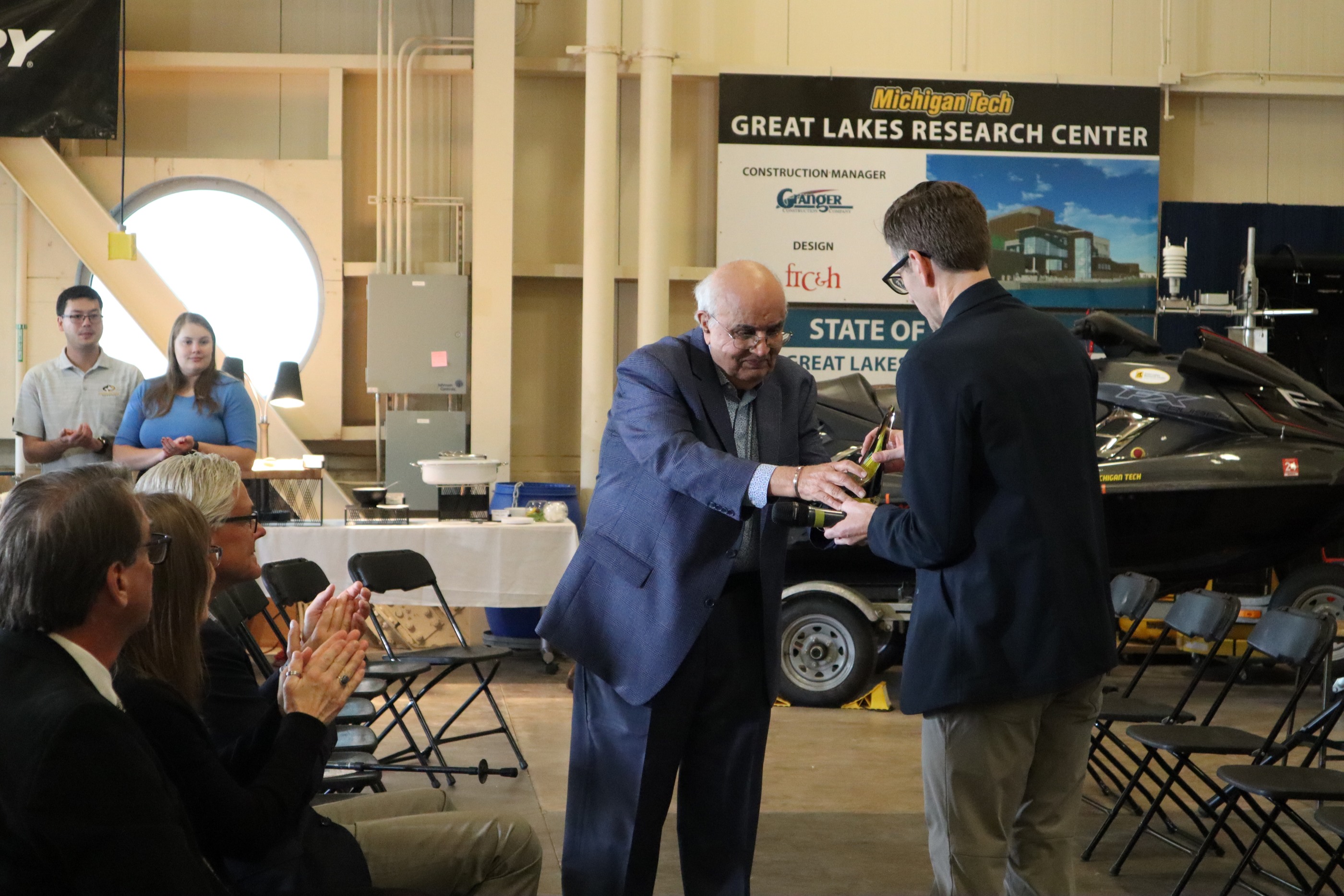 Kanwal Rehki accepting his Honor Academy Award. Kanwal Rekhi being handed an award.