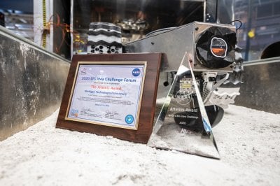 2020 Big Idea Challenge Forum Artemis Award certificate and pyramid next to the winning rover.