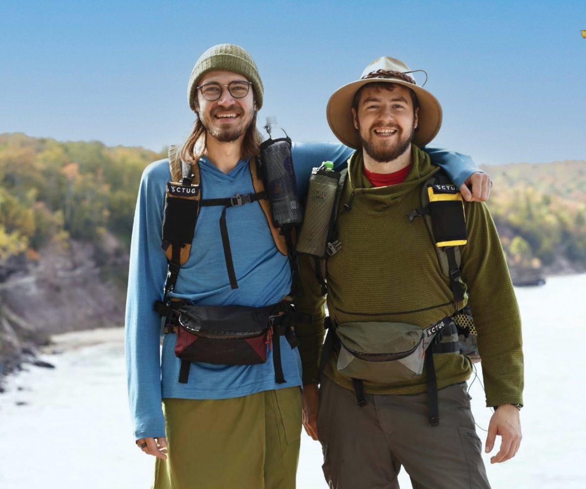 Austin Gongos and Nathan Ackerman wearing several pieces of gear standing outside.