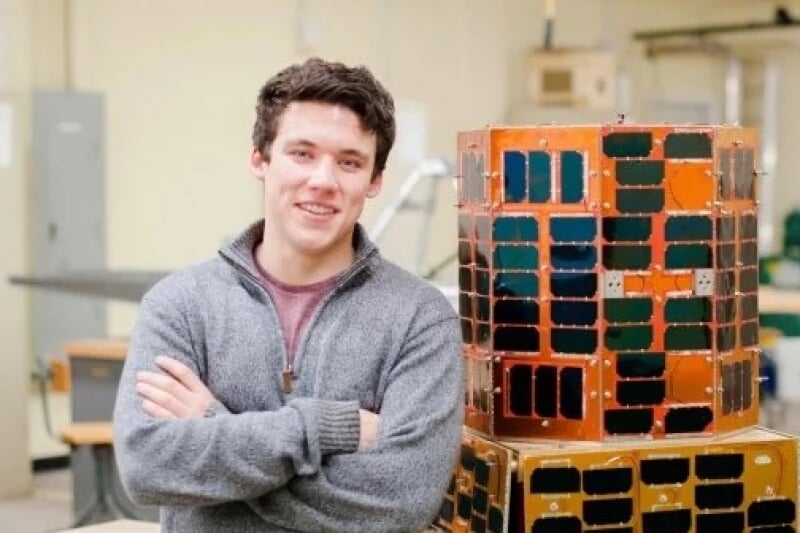 Sam Baxendale ‘17 with Oculus-ASR, a student-built nanosatellite