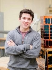 Sam Baxendale ‘17 with Oculus-ASR, a student-built nanosatellite