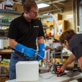 Workers in lab testing Nasa Watts equiptement