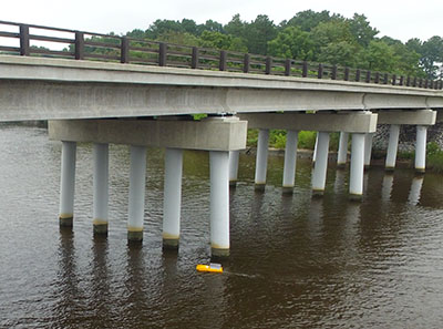 Bathyboat moving under a bridge.