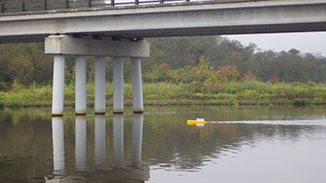 Bathyboat going under a bridge.