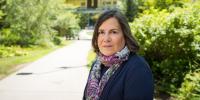 Jennifer Becker stands in front of MTU's library