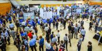 Students and recruiters gathered in a crowd on the floor of the SDC wood gym.