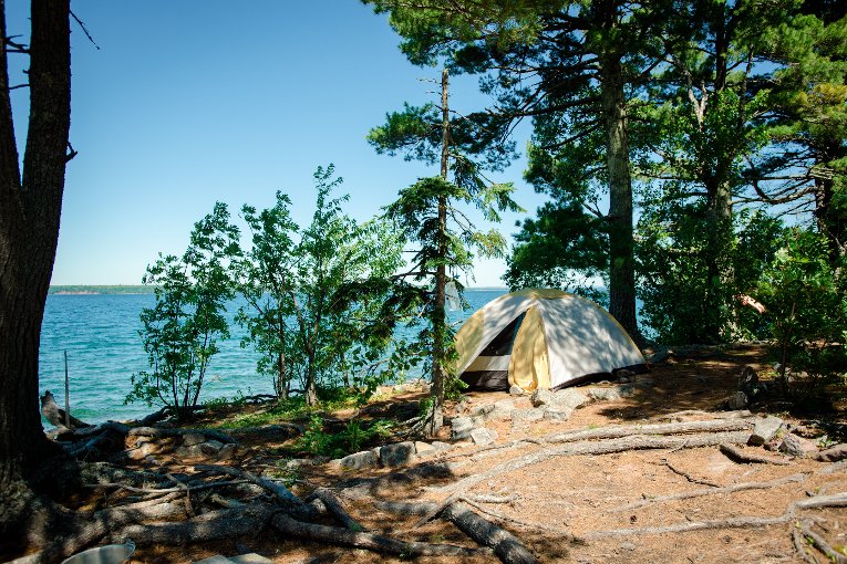 Rabbit Island tent sleeping "Sauna Sessions" artists Falconberry and Boyd slept at the water's edge, in a small tent.