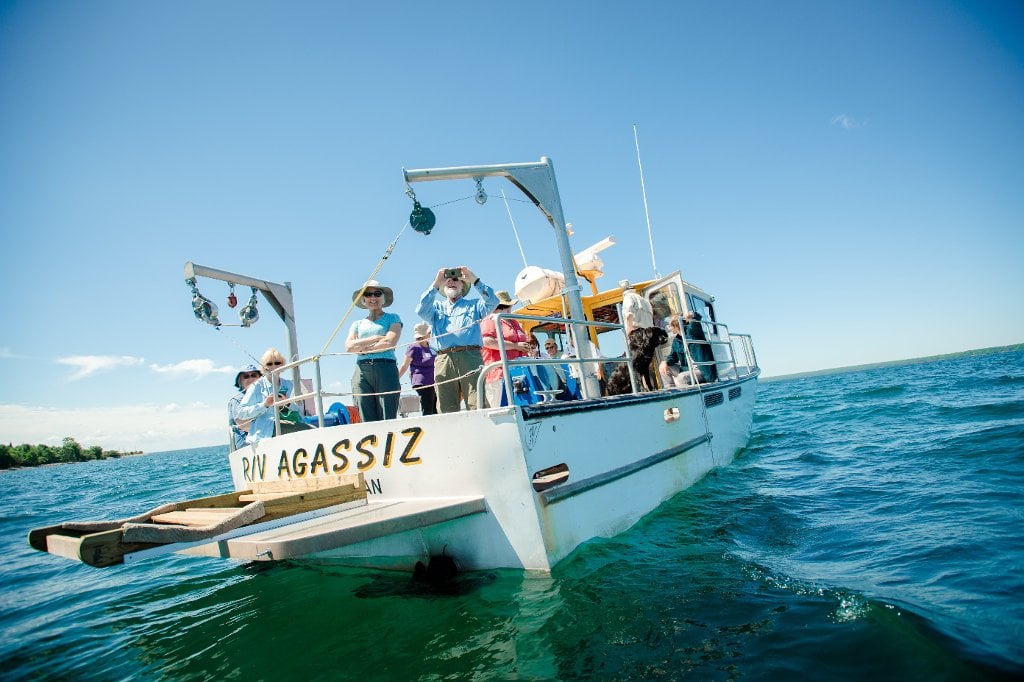 Geotourists anchored off Rabbit Island as part of a day-long excursion focusing on Jacobsville Sandstone. Rabbit Island Aboard the Agassiz