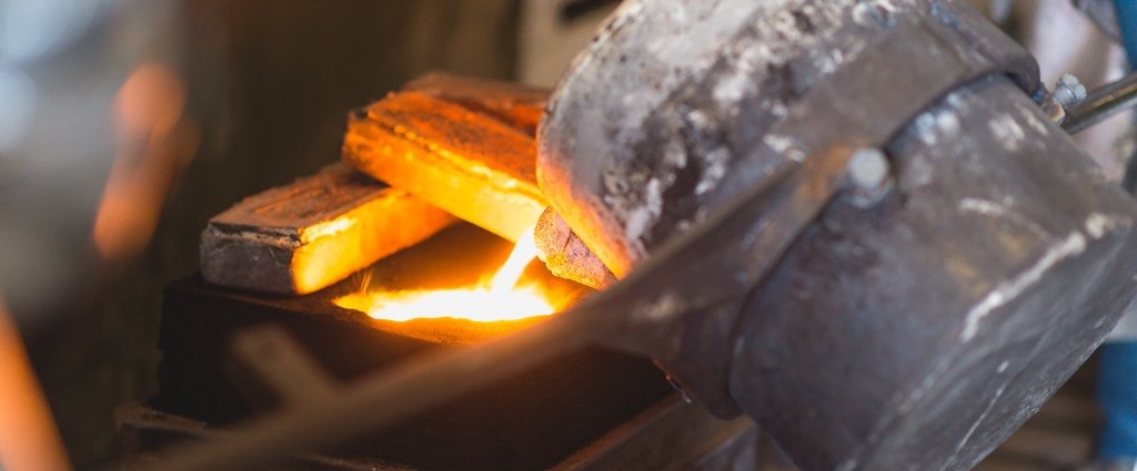 The pouring basin is kept full so that the molten metal quickly fills the mold cavity. crucible in a foundry pouring molten metal