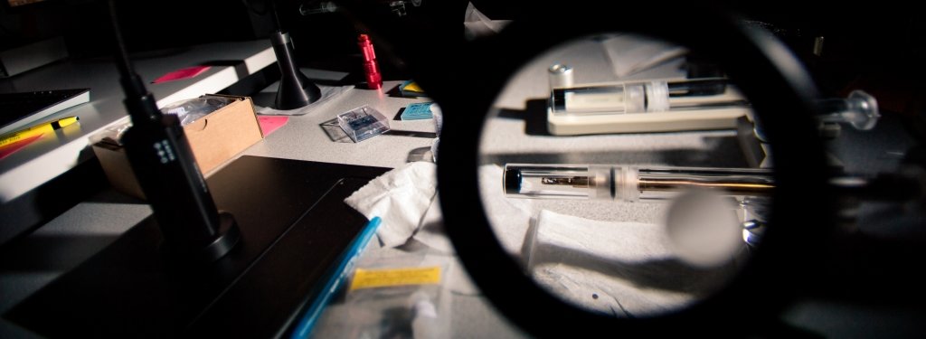 Imaging at an atomic resolution is delicate work – the scanning transmission electron microscope (STEM) at Michigan Tech may help researchers develop new and exciting nanomaterials. Tools used to adjust samples before they are analyzed in the scanning transmission electron microscope magnified by a magnifying glass.