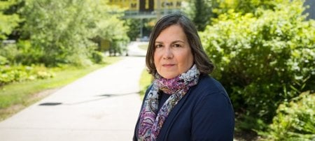 Jennifer Becker stands in front of MTU's library