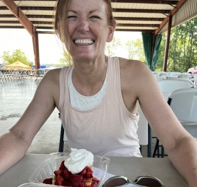 LaReesa Wolfenbarger sitting at a table with strawberry shortcake.