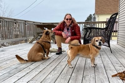 Michelle Scherer and two small dogs.